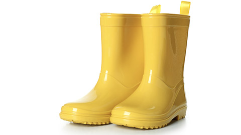 Yellow rubber boots isolated on white background