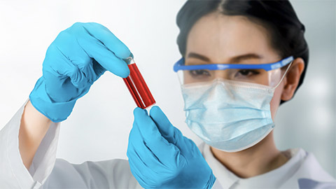 a person holding a tube of an infectious disease
      