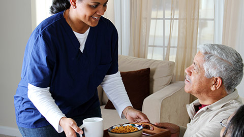 A carer helping a client