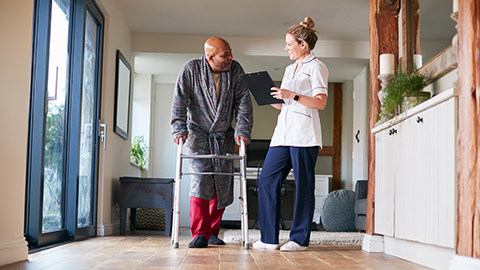 A carer helping a client