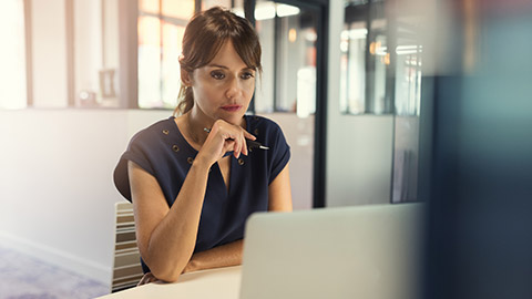 A person at a desk with a computer