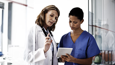 doctor giving a nurse instructions at a hospital