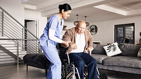 Nurse helping man in wheelchair, home and trust for medical service, physical therapy and support in retirement. Caregiver, woman and aid old patient with disability, rehabilitation and healthcare