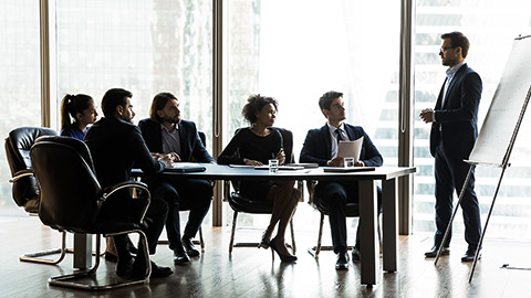 mixed race business people listening to educational lecture