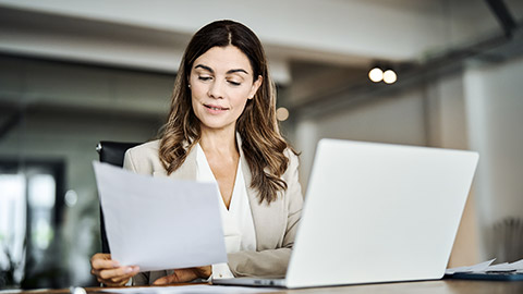 office woman checking papers