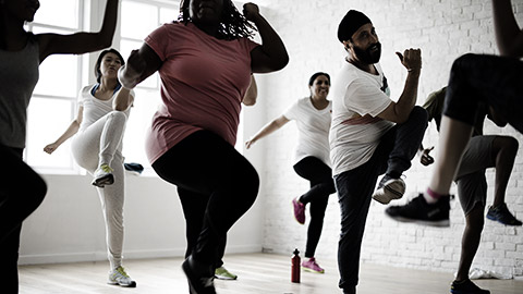 A group of people doing aerobics