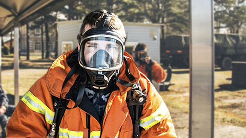 A firefighter wearing full PPE