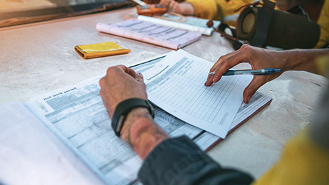 A person filling out paperwork