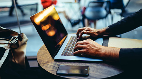 A marketer monitoring a recently-launched campaign on their laptop