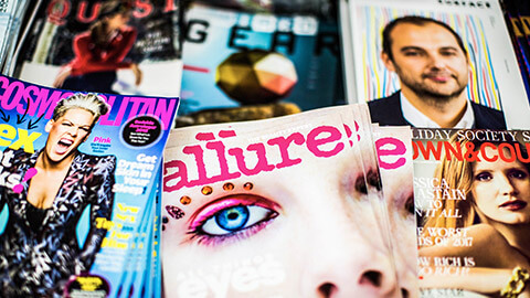 A spread of magazines on a table