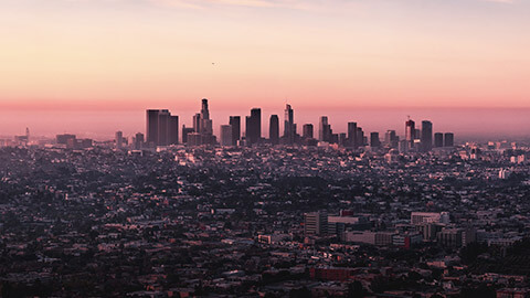 A panoramic image of a city in pre-dawn light