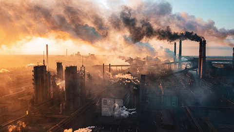 An aerial shot of a manufacturing facility at sunrise