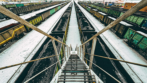 Train carriages at a major station, full of raw materials, ready to be exported to neighbouring countries