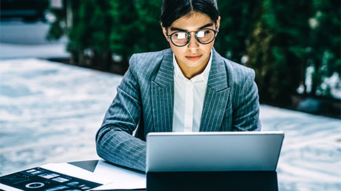 A fund manager reviewing different, open positions in the portfolio that they manage