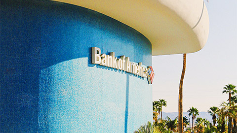 A side view of a Bank of America branch on a sunny afternoon