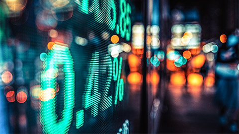 An LED display conveying relative price increases of top-performing stocks and equities