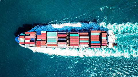 A shipping container travelling at pace, couriering freight across the Pacific Ocean