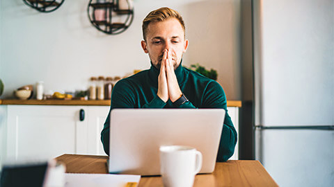 An entrepreneur seated in front of their laptop, taking the time to reflect on some of the opportunities in front of them