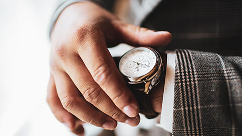 A close view of a rich man showing off his luxury watch