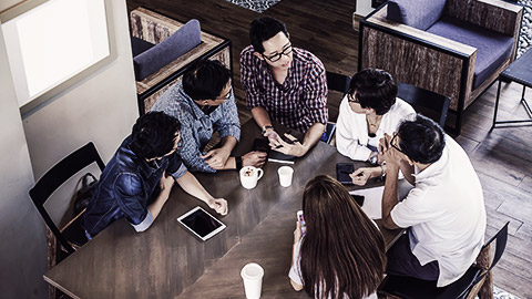 A group of people having a team meeting