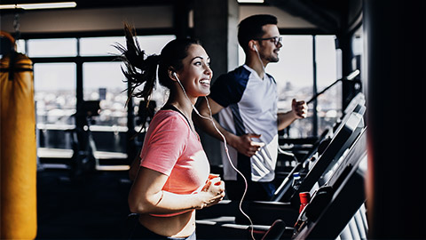 A couple working out in the gym together