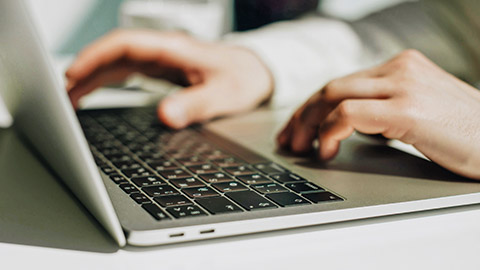 A close view of a person typing