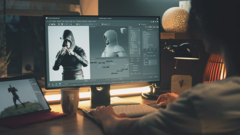 Over-the-shoulder view of a game designer working