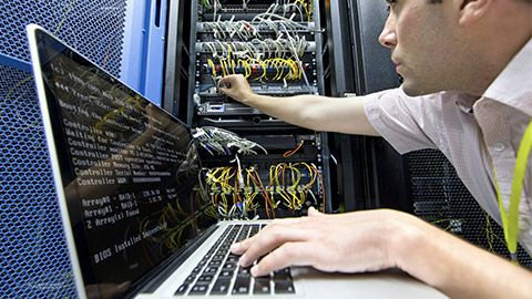 Technician fixing the computer