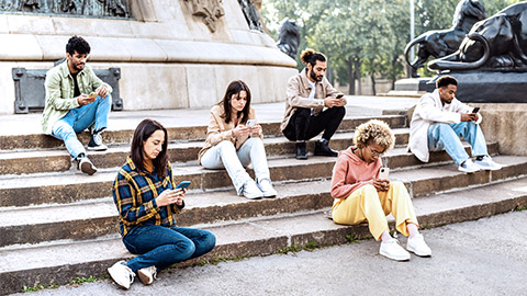 Teens social distancing while using mobile phones