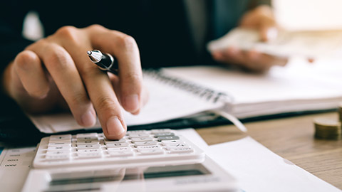 A person using a calculator