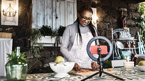 A person preparing healthy food for a video