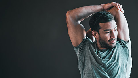 A person stretching before a workout