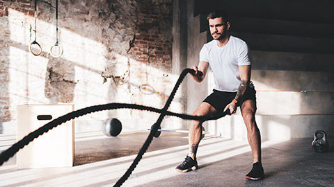 A person working out in a grungy gym