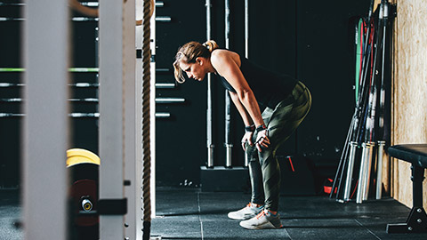 A person showing fatigue in a gym