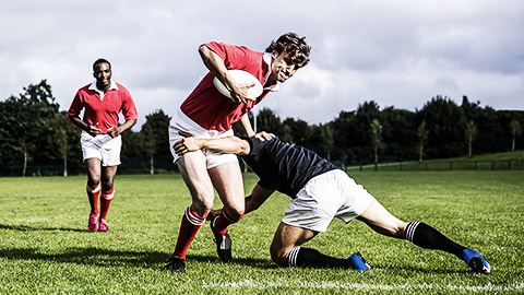 A rugby player putting in max effort