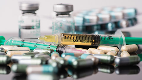 Steroids and syringes on a table