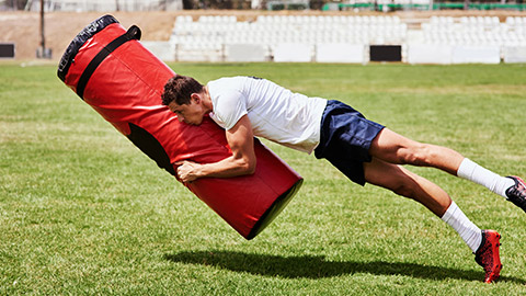 A person doing tackle practice