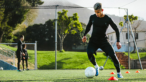 A soccer player training