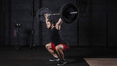 A person doing olympic weightlifting