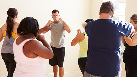 A trainer with a group of people from a special populations group