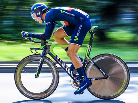 A cyclist in high speed position on bike