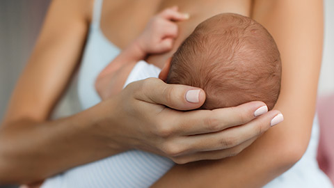 A close view of a mother breastfeeding