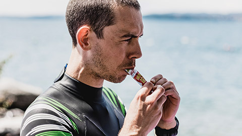 An athlete eating a sports gel