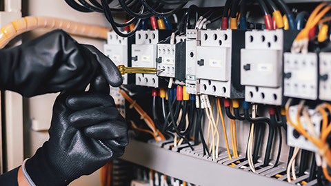 A close view of an electrician working on a site