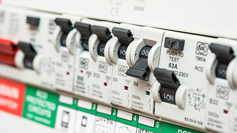 A close view of a line of circuit breakers