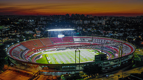 A wide shot of a stadium lit up at night