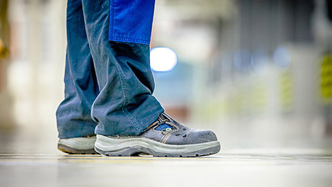 A person wearing safety boots