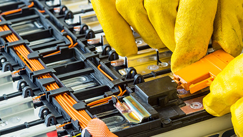 An electrician working on a li-ion battery