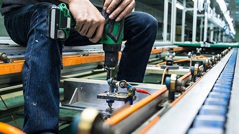 A person working on a conveyor belt