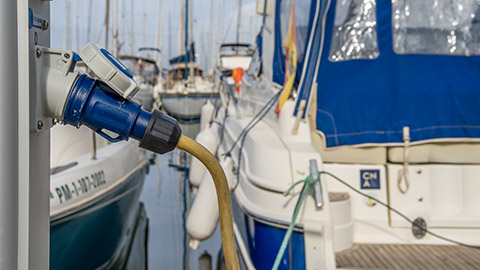 Close-up of an electrical charging point of a boat in a marina